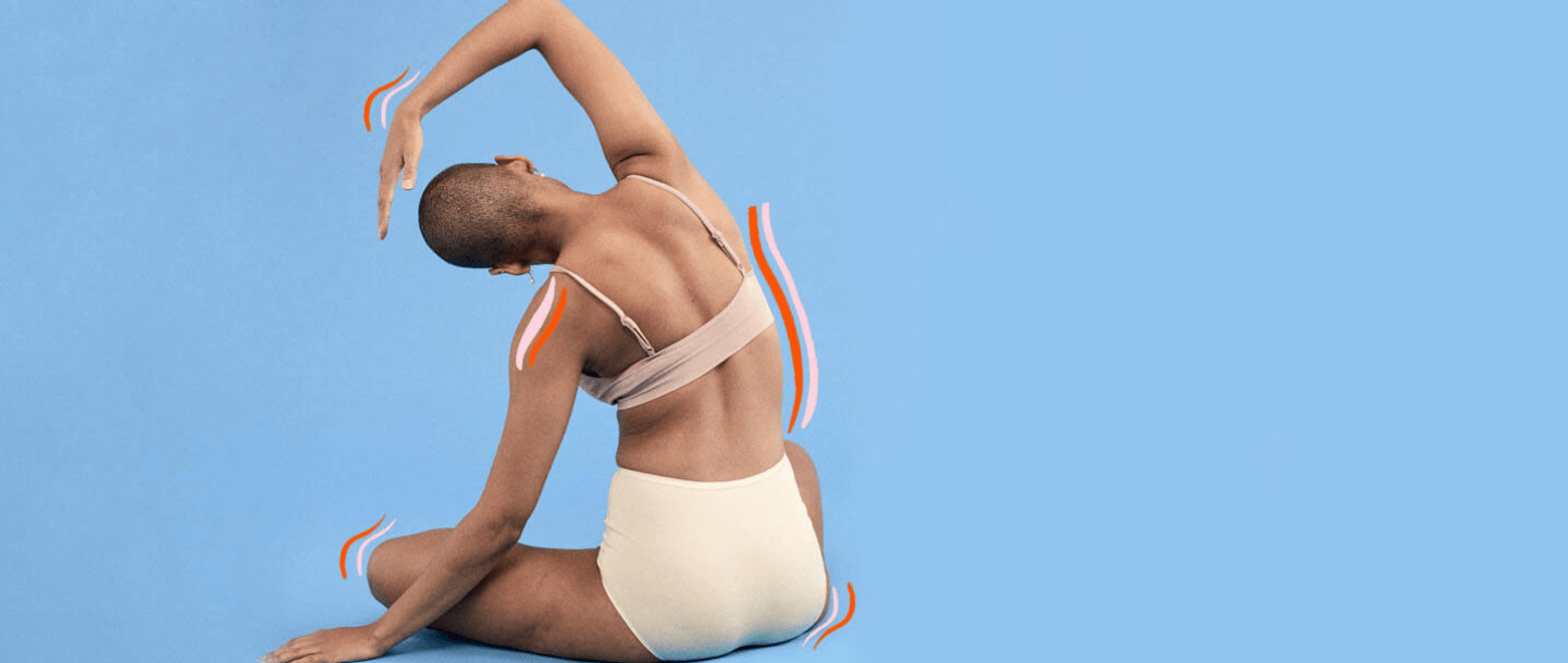 Young woman with back to camera stretching arm over head