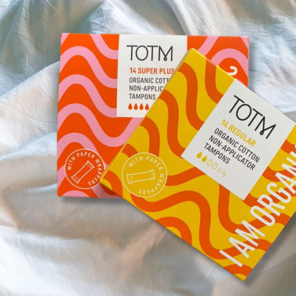 Two boxes of TOTM non applicator tampons, on bedsheets