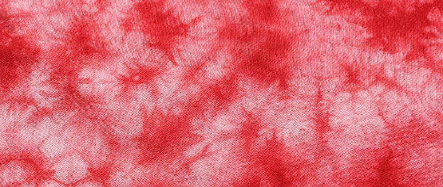 Pink and red tie dye pattern to represent bleeding during pregnancy