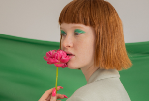 Fashionable girl with green background and flowert