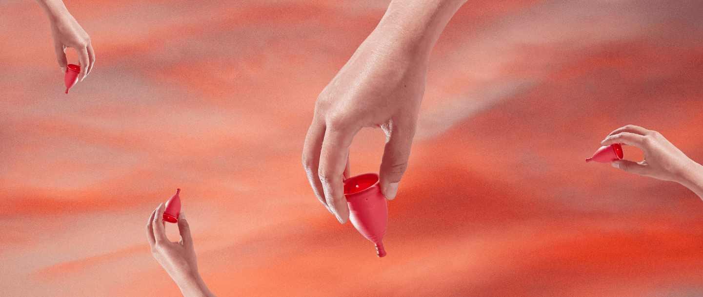 TOTM reusable zero waste menstrual cup on a red background