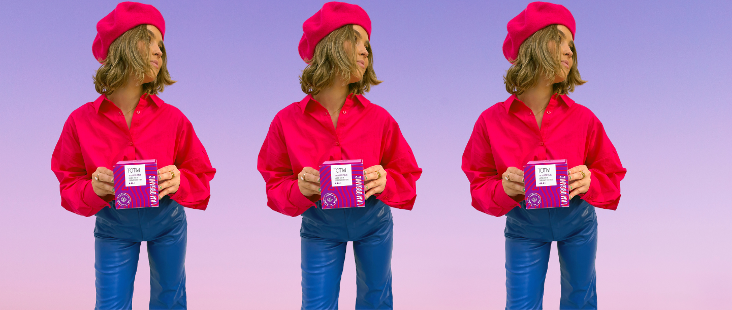 Girl in pink shirt and blue trousers holding TOTM super flow pad box for Tesco Express launch announcement